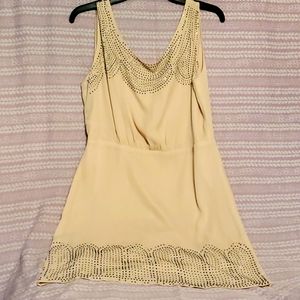 Beige dress, black and silver detail. Open tie back with zipper.